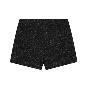 Détail de la texture en tweed noir et blanc sur ce short à taille haute chic