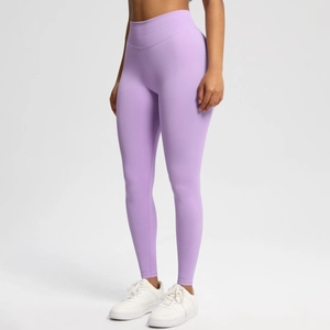 Detail of high-waist seamless purple yoga leggings showing honeycomb texture and elastic waistband