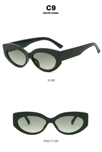 Detail view of vintage cat-eye sunglasses in dark green finish with gradient lenses