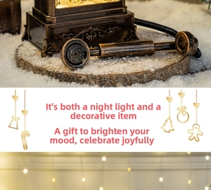Detail of vintage bronze phone night light with faux snow and wooden base for Christmas