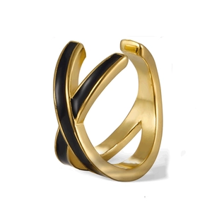 Close-up of golden S925 silver ear cuff featuring black enamel in a double-layer X-shape