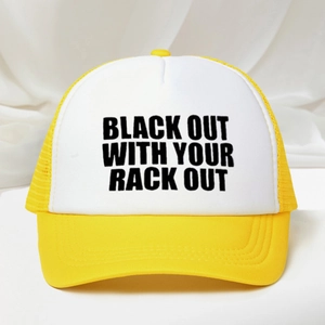 Yellow and white trucker hat with BLACK OUT print on a textured fabric background