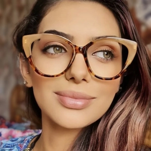 Detail of TR90 cat-eye glasses with two-tone khaki and tortoiseshell frames on a model
