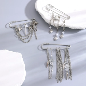Silver safety pin brooches featuring heart charms, stars, and multi-layer fringe tassels
