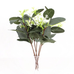 Detailed view of artificial eucalyptus stems with green leaves and small white berries