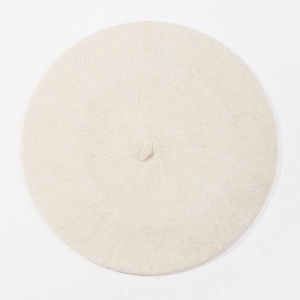 Top view of a beige wool blend beret showing fine knitted texture and classic stem