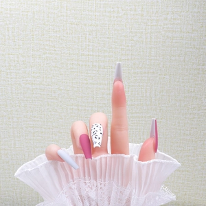 Long ballerina press-on nails with pink leopard patterns and white lace sleeve accent
