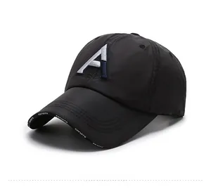 Detail of black baseball cap with 3D letter A embroidery and sports brim text