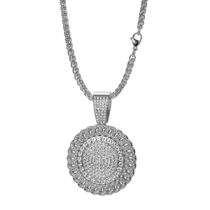 Close-up of hip-hop silver necklace with iced-out round pendant and braided chain detail