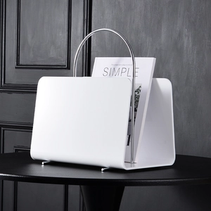 Modern white acrylic magazine rack with metallic silver handle for desk and floor storage
