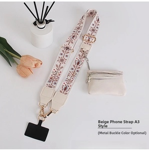 Detail of cream ethnic pattern shoulder strap with matching coin purse and gold hardware