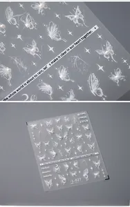 Detail of 5D embossed butterfly nail stickers with white pearl accents and stars
