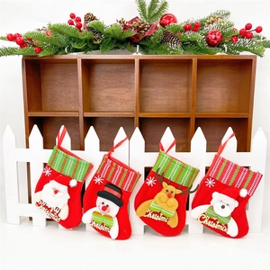 Detailed view of four mini Christmas stockings with 3D Santa, Snowman, Reindeer, and Bear