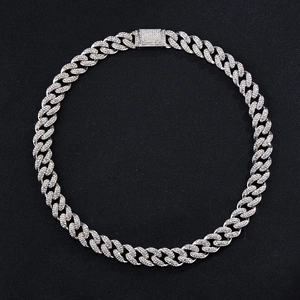 Close-up of sparkling rhinestone pavé silver Cuban chain necklace with iced out box clasp
