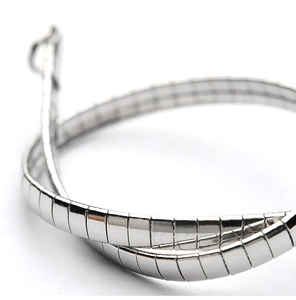 Macro shot of polished silver metal chain links with high quality finish detail