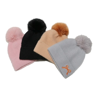 Winter fleece lined knit hats with faux fur pom and bow embroidery in four colors