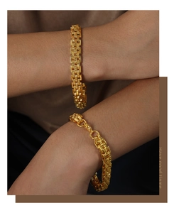 Detail of gold-plated titanium steel tank chain bracelet featuring vintage woven texture