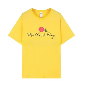 Detail of yellow Mother's Day Brunch t-shirt featuring a red rose print and cotton texture
