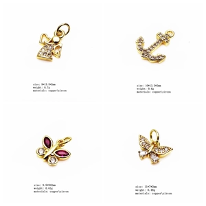 Detailed view of four golden copper and zircon jewelry pendants with exact dimensions