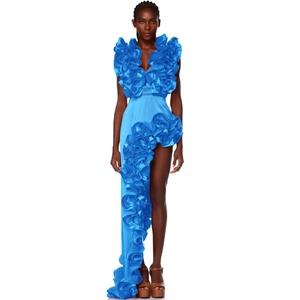 Detail of bright blue swimsuit dress with ruffled V-neck and asymmetrical hemline