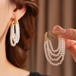 Vintage gold multi-strand pearl hoop earrings with zircon stones and elegant design