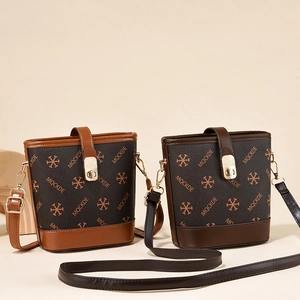 Chic two-tone bucket bags with MQCKDE monogram print and adjustable straps in synthetic leather