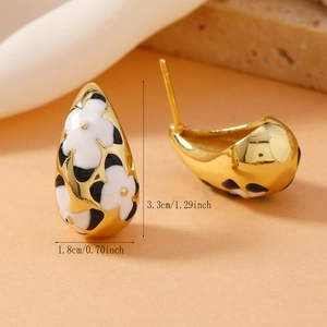 Detailed view of teardrop earrings with gold plating and enamel floral pattern, 3.3cm height