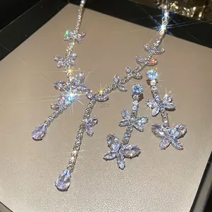 Luxurious silver butterfly necklace and fringe earrings set with zircon stones