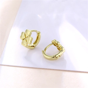 Minimalist gold clover hoop earrings for women featuring a hollow geometric heart design