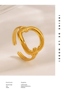 Detailed close-up of a 14K gold plated hollow geometric ring with an open adjustable design
