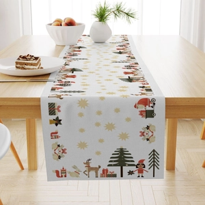 Christmas linen table runner with Santa Claus and reindeer patterns on a wooden table