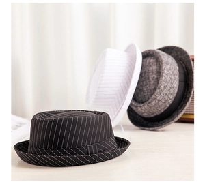 Detailed view of three jazz hats in black pinstripe, white stripe, and grey texture