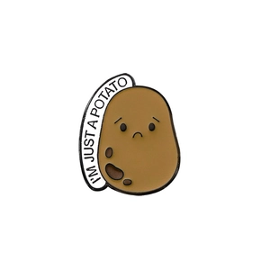Cartoon potato enamel pin with black glasses and I'M JUST A POTATO quote bubble