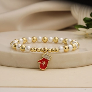Elegant Christmas beaded bracelet with white pearls, gold beads and a red glove charm