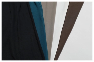 Detail of high-density matte yoga fabric with multi-color swatches and professional stitching
