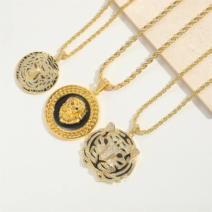 Detailed view of three gold twist chains with leopard lion and tiger head pendants