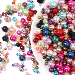 Macro shot of colorful ABS polished faux pearls in various sizes for DIY craft jewelry