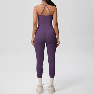Rear view of purple yoga set featuring criss-cross back straps and high-waisted leggings