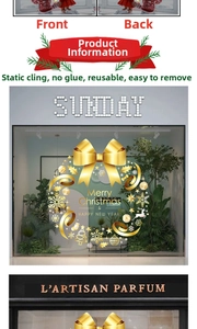 Close-up of golden Christmas wreath window stickers with reindeer and snowflake details