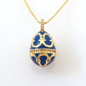 Detail of egg-shaped enamel pendant with gold filigree and pavé cubic zirconia