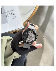 Detail of multi-dial quartz watch with grey silicone strap and industrial metal case