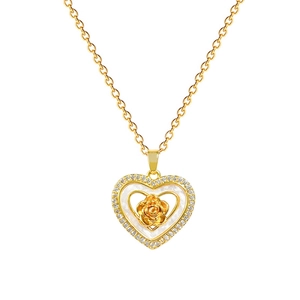 Luxurious gold heart pendant necklace with rose shell inlay and sparkling crystal border