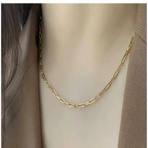 Polished 18K gold 4mm paperclip link chain necklace for men and women worn with a blazer
