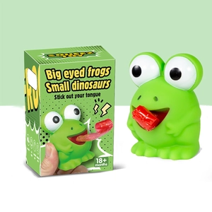 Green frog squeeze toy with big eyes and tongue-out feature, including retail packaging