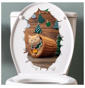 3D Christmas wall sticker featuring an orange cat in a basket on a white toilet lid