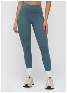 Detail view of high-waisted yoga leggings showing the seamless slimming fabric texture