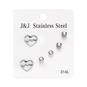 Detail of 3-pair stainless steel stud earrings set featuring hearts and zircons
