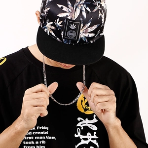 Close-up of a silver 3:1 NK link chain necklace worn by a model in streetwear style