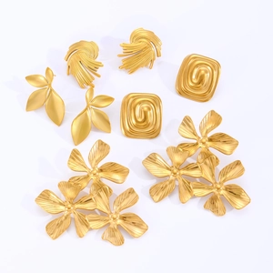 Golden vintage stainless steel leaf and floral stud earrings set on white background