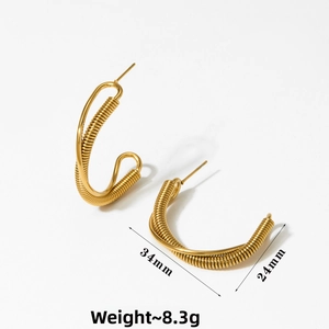 Detail view of gold C-shape twisted earrings showing 34mm size and 8.3g weight